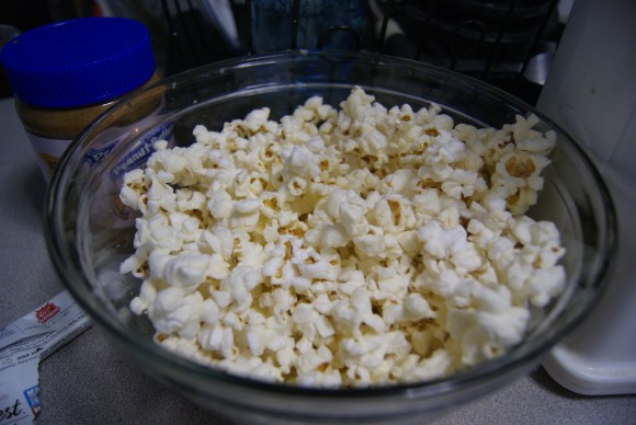 Large glass bowl. Popcorn. Creative captioning.