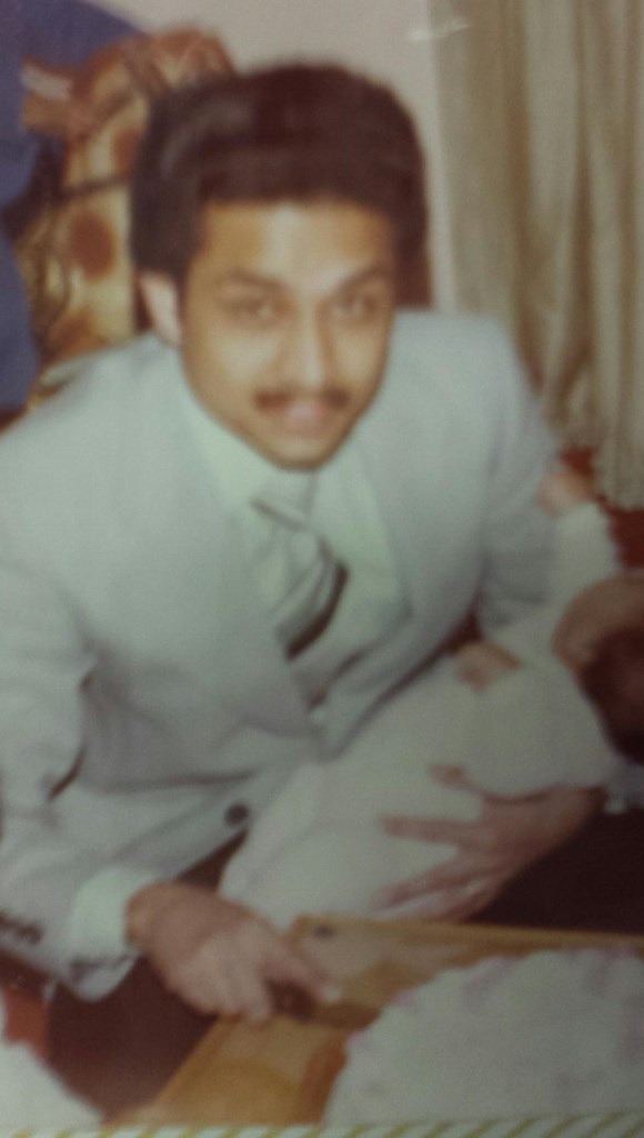 He will very likely end me if he finds out this picture is on the internet, but seriously people: check out that swagger. Dude is holding an infant and cutting a cake like it's NBD. I'd have trouble doing one of those things with total confidence.